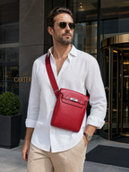 Man wearing the Sinclair red sling bag in front of a hotel