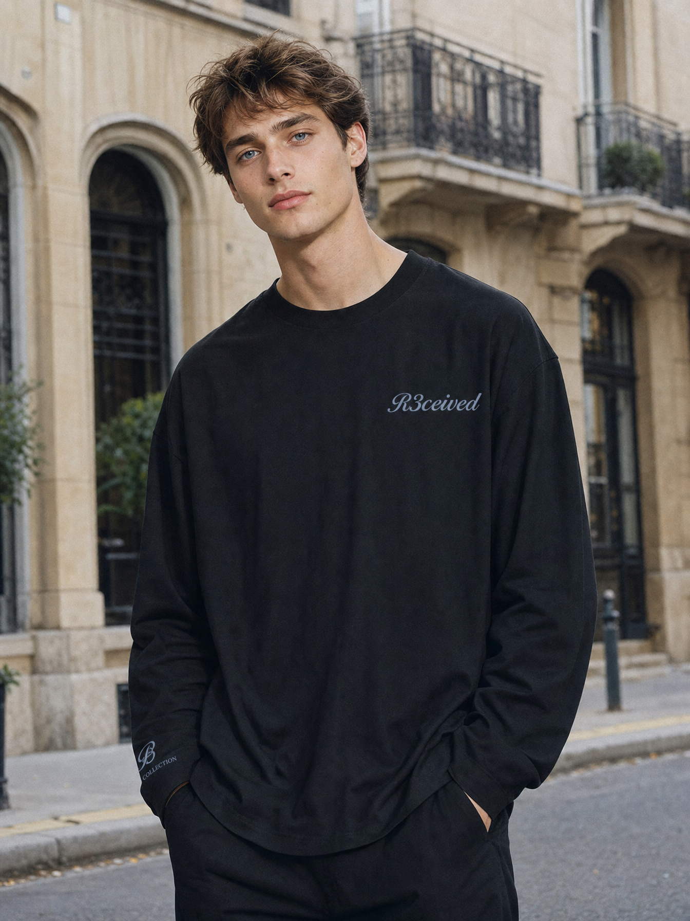 Granted in Style Long Sleeve zwart - model draagt de voorkant met R3ceived logo op een Parijse straat