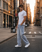 Male model wearing R3CEIVED Retro Wash Straight Jeans, side view