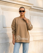 R3CEIVED Circle of Life long sleeve top Camel - female lifestyle front view