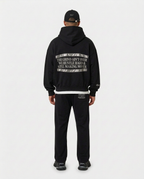 Full-body back view of the black Hustler Mid R3 hoodie by R3CEIVED