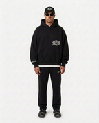 Full-body look with the black Hustlers Classic Hoodie by R3CEIVED