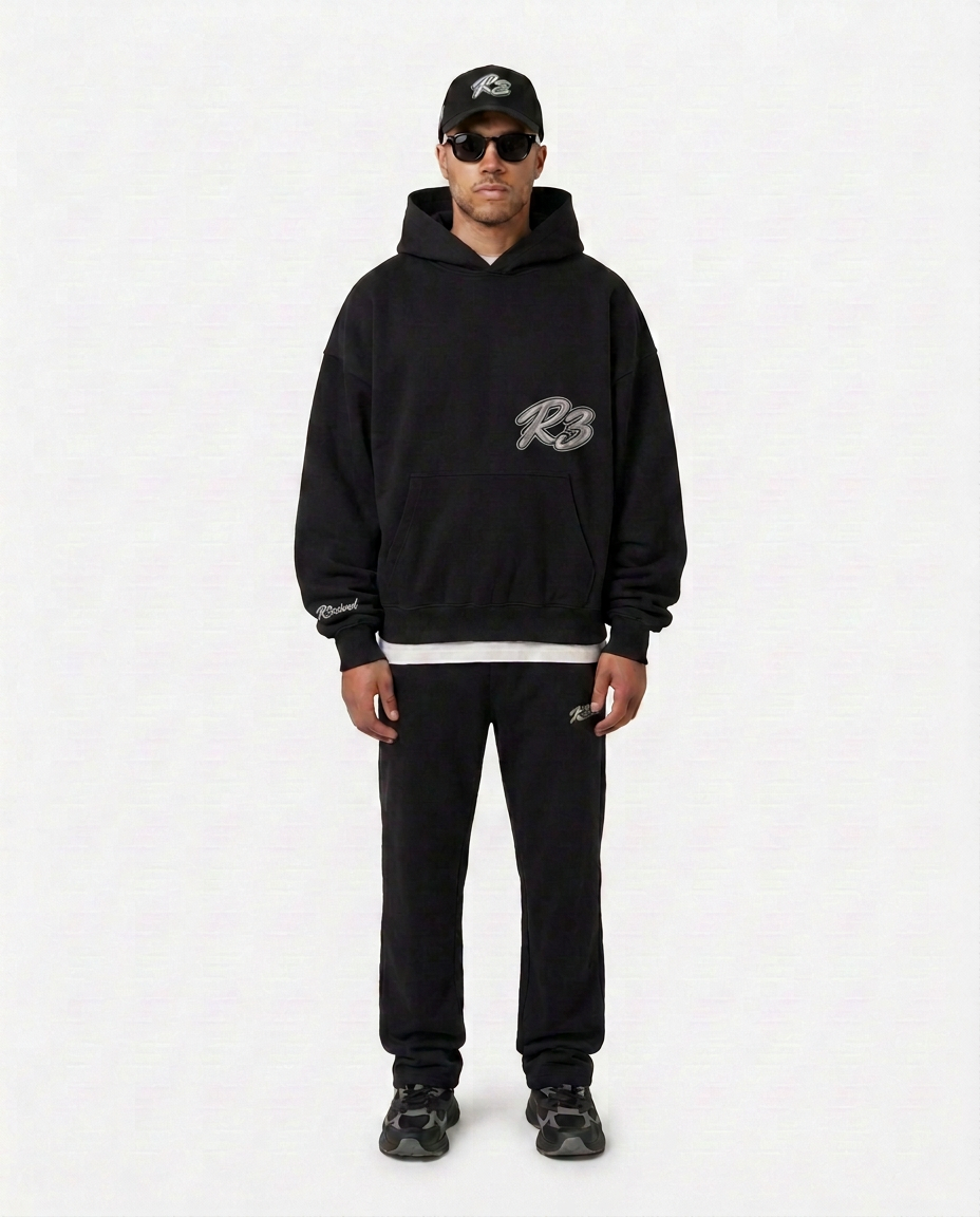 Full-body look with the black Hustlers Classic Hoodie by R3CEIVED