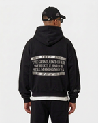 Back print of the black Hustlers Classic Hoodie by R3CEIVED on model