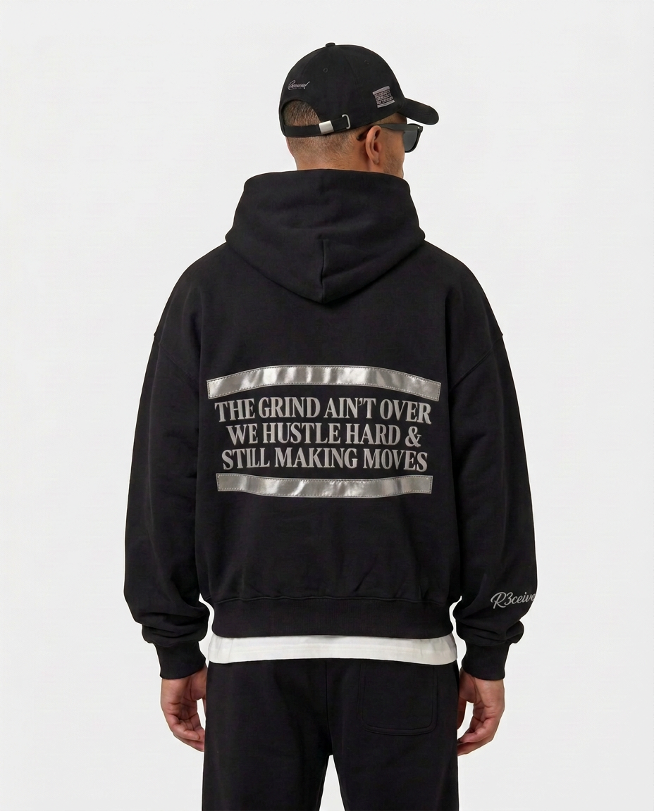 Back print of the black Hustlers Classic Hoodie by R3CEIVED on model