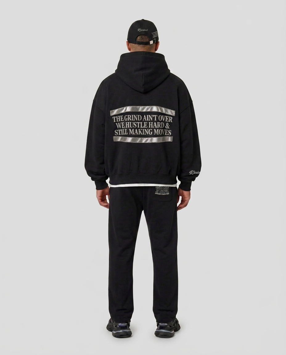 Full-body back view of the black Hustlers Classic Hoodie by R3CEIVED