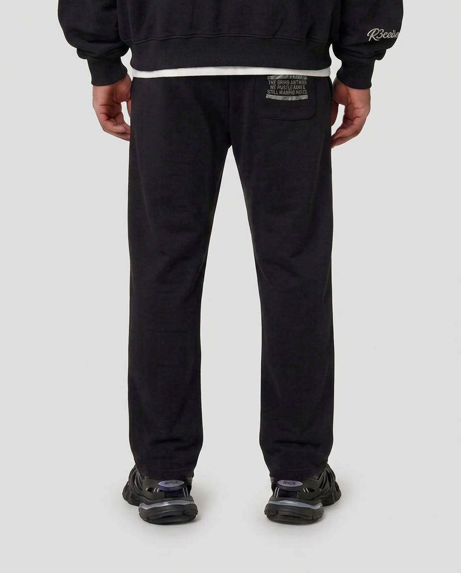 Back pocket print of the black Hustlers Jogger by R3CEIVED on model
