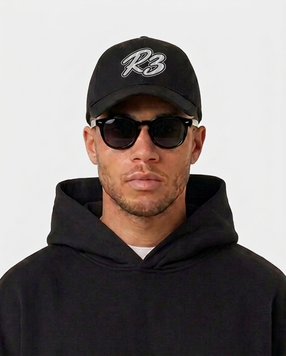 Model wearing the black Hustlers Baseball Cap by R3CEIVED, front view