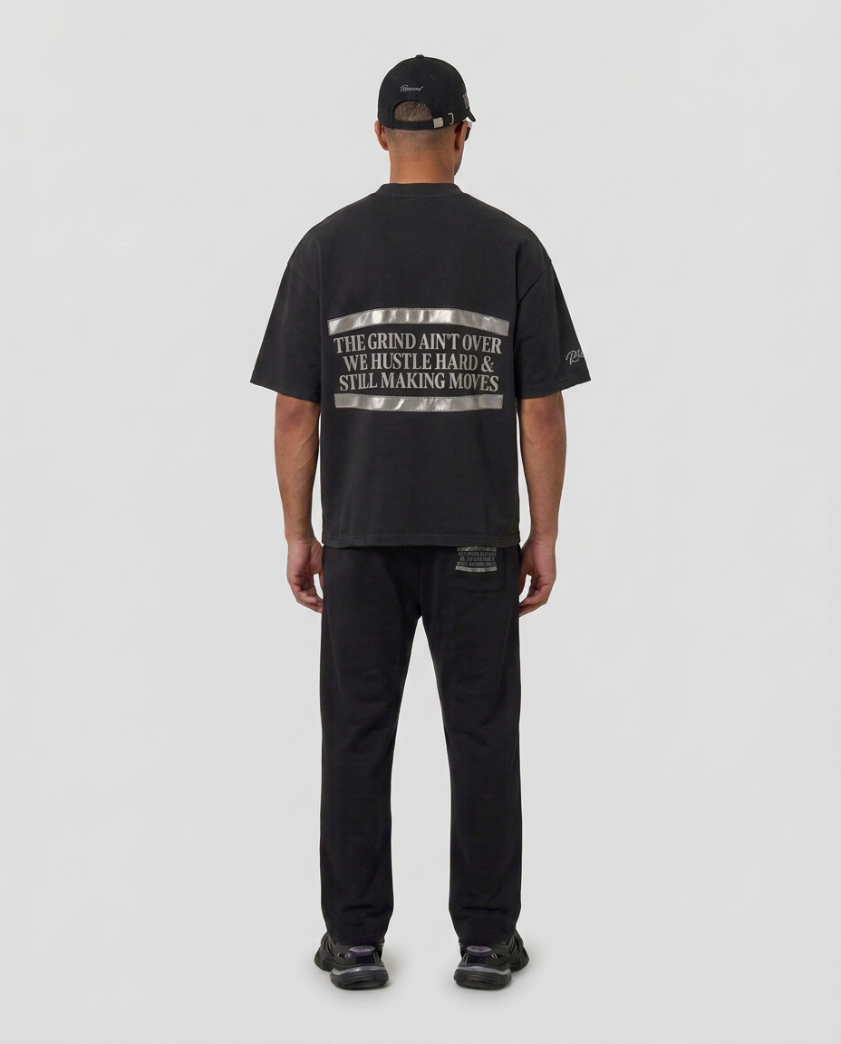 Full-body back view of the black Hustlers Washed Drop-Shoulder T-Shirt by R3CEIVED