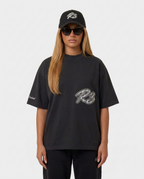 The Hustlers Washed Drop-Shoulder T-Shirt black - female model front view