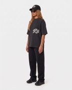 The Hustlers Washed Drop-Shoulder T-Shirt black - female model angled view