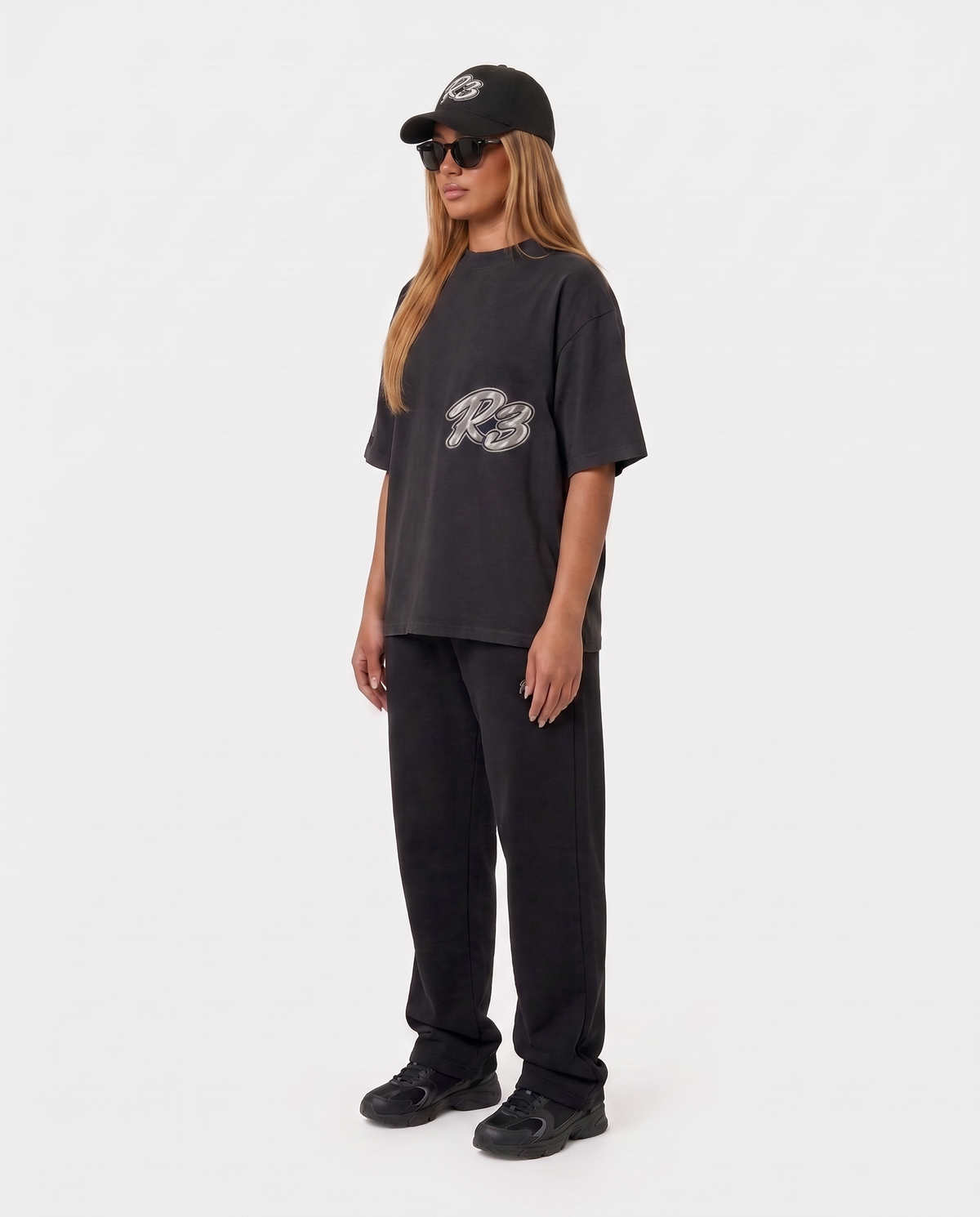 The Hustlers Washed Drop-Shoulder T-Shirt black - female model angled view
