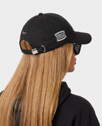 Hustlers Cotton Baseball Cap black - female model angled back view with buckle strap