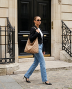 Woman carrying the Polkadot Bag in Camel on her shoulder